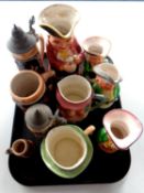 A tray containing German pottery beer steins,