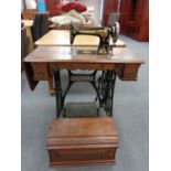 A Victorian Singer treadle sewing machine and accessories
