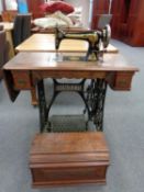 A Victorian Singer treadle sewing machine and accessories