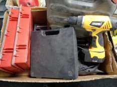 A box containing power tools, staple gun,