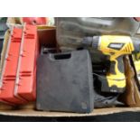 A box containing power tools, staple gun,