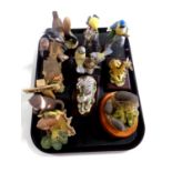 A tray containing assorted animal ornaments to include Heredities hedgehog family,