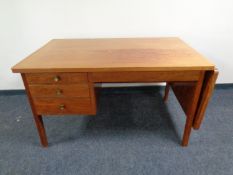 A mid century desk with drop end