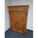 A 19th century oak secretaire cabinet