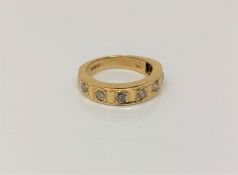 An 18ct gold diamond set half eternity ring, approx. 0.