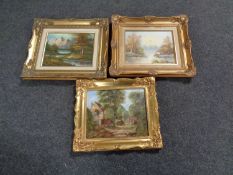 Three gilt framed oil paintings depicting landscapes and buildings