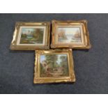 Three gilt framed oil paintings depicting landscapes and buildings