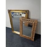 A Victorian style gilt framed mirror together with a further carved wooden framed mirror