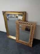 A Victorian style gilt framed mirror together with a further carved wooden framed mirror