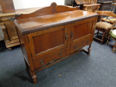 An oak Edwardian sideboard