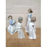 Four Nao figures depicting children in various studies (4)