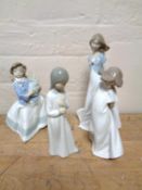 Four Nao figures depicting children in various studies (4)