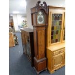 A Hamilton and Inches Tempus Fugit grandmother clock with key and weight