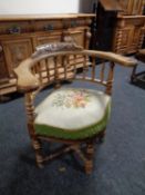 A continental oak corner chair with tapestry seat