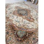 A large Tabriz design carpet,