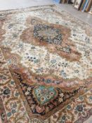 A large Tabriz design carpet,