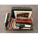 A box containing a large quantity of postcards, photograph albums,