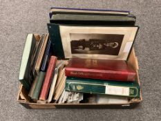 A box containing a large quantity of postcards, photograph albums,