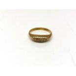 An antique 18ct gold five stone diamond ring,