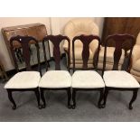 A set of four reproduction Queen Anne style dining chairs