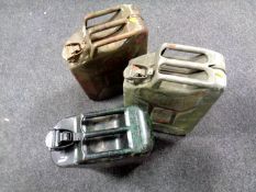 Three metal fuel cans