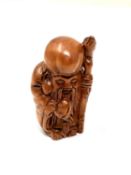 A carved Chinese hardwood netsuke - Village elder with staff