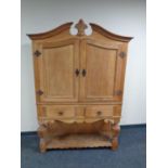 A traditional style double door sideboard fitted with two drawers