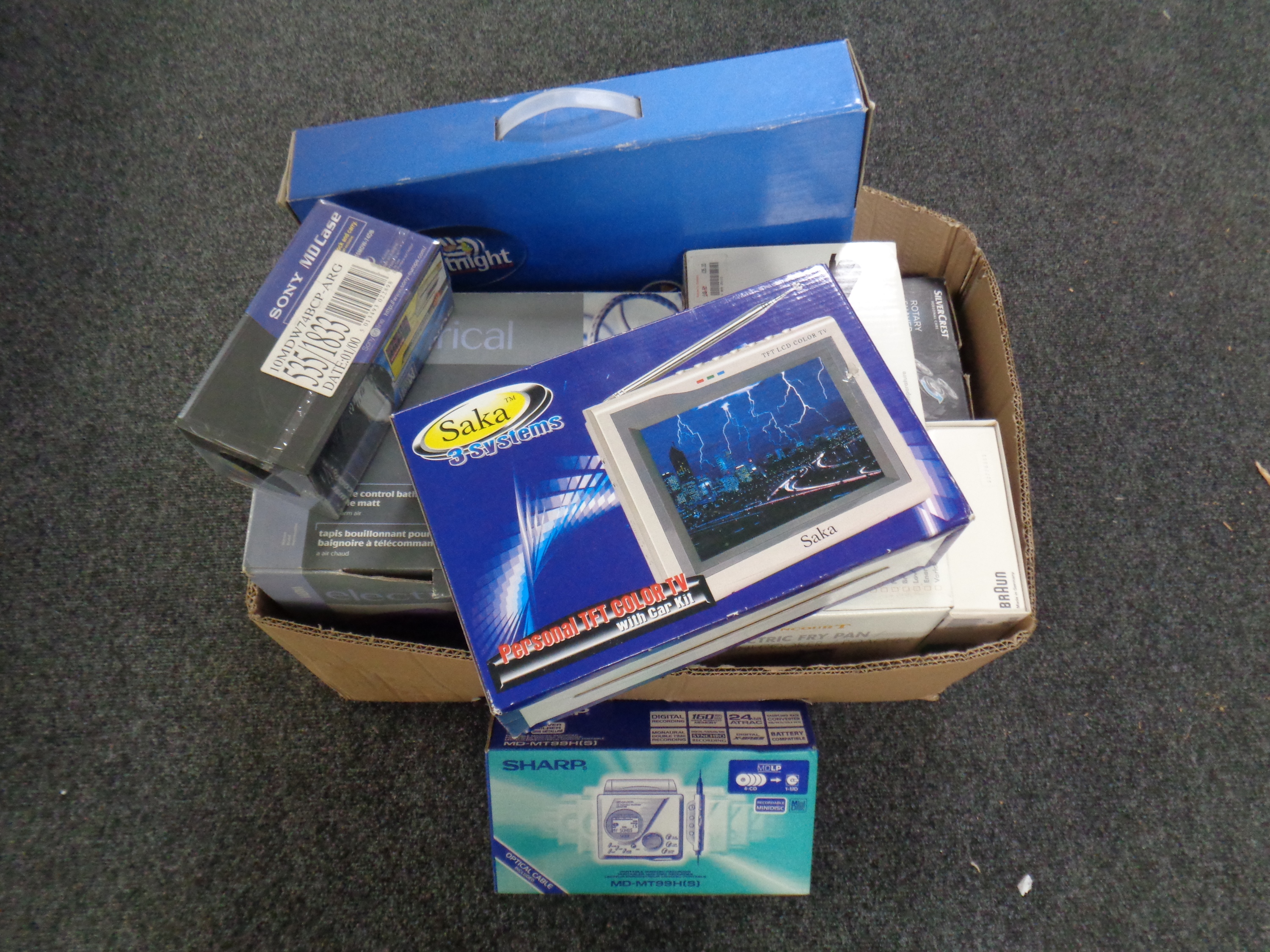A box containing a quantity of boxed electricals including mini cooker, mini colour TV,