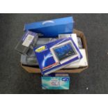 A box containing a quantity of boxed electricals including mini cooker, mini colour TV,