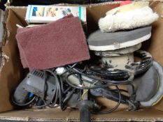 A box containing power tools, drill, grinder,