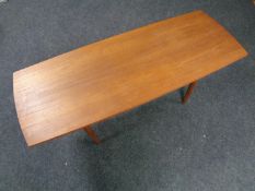 A mid century teak coffee table