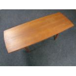 A mid century teak coffee table