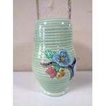 A Clarice Cliff Newport Pottery vase on ribbed ground with floral blossom