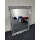 A silvered framed bevelled edge mirror