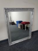 A silvered framed bevelled edge mirror