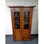 An early 20th century mahogany glazed bookcase