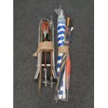 Two bundles of assorted walking sticks,