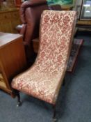 A late Victorian beech framed bedroom chair