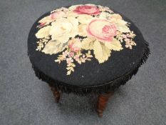 A tapestry upholstered stool on turned legs