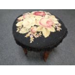 A tapestry upholstered stool on turned legs