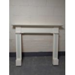 A painted white fire surround