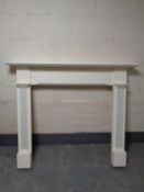 A painted white fire surround