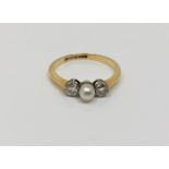 An 18ct gold pearl and diamond ring, size P. CONDITION REPORT: 2.4g.