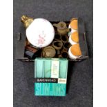 A box containing Hornsea storage jars, Kodak camera, light shade, boxed raven head glasses,
