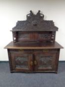 A 19th century carved oak sideboard