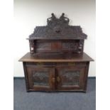 A 19th century carved oak sideboard