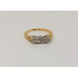 An antique 18ct gold platinum three stone diamond ring, size I CONDITION REPORT: 2.