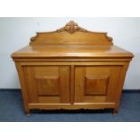 A mid century light pine sideboard