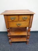 A 19th century mahogany three drawer side table