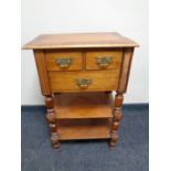 A 19th century mahogany three drawer side table